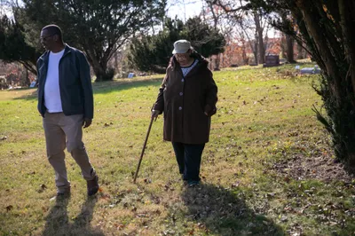 Harry and Janis Ivory walk through the cemetery where their parents are buried in Rendville, OH. Janis, her brother Harry and others are working to revitalize the old coal town.